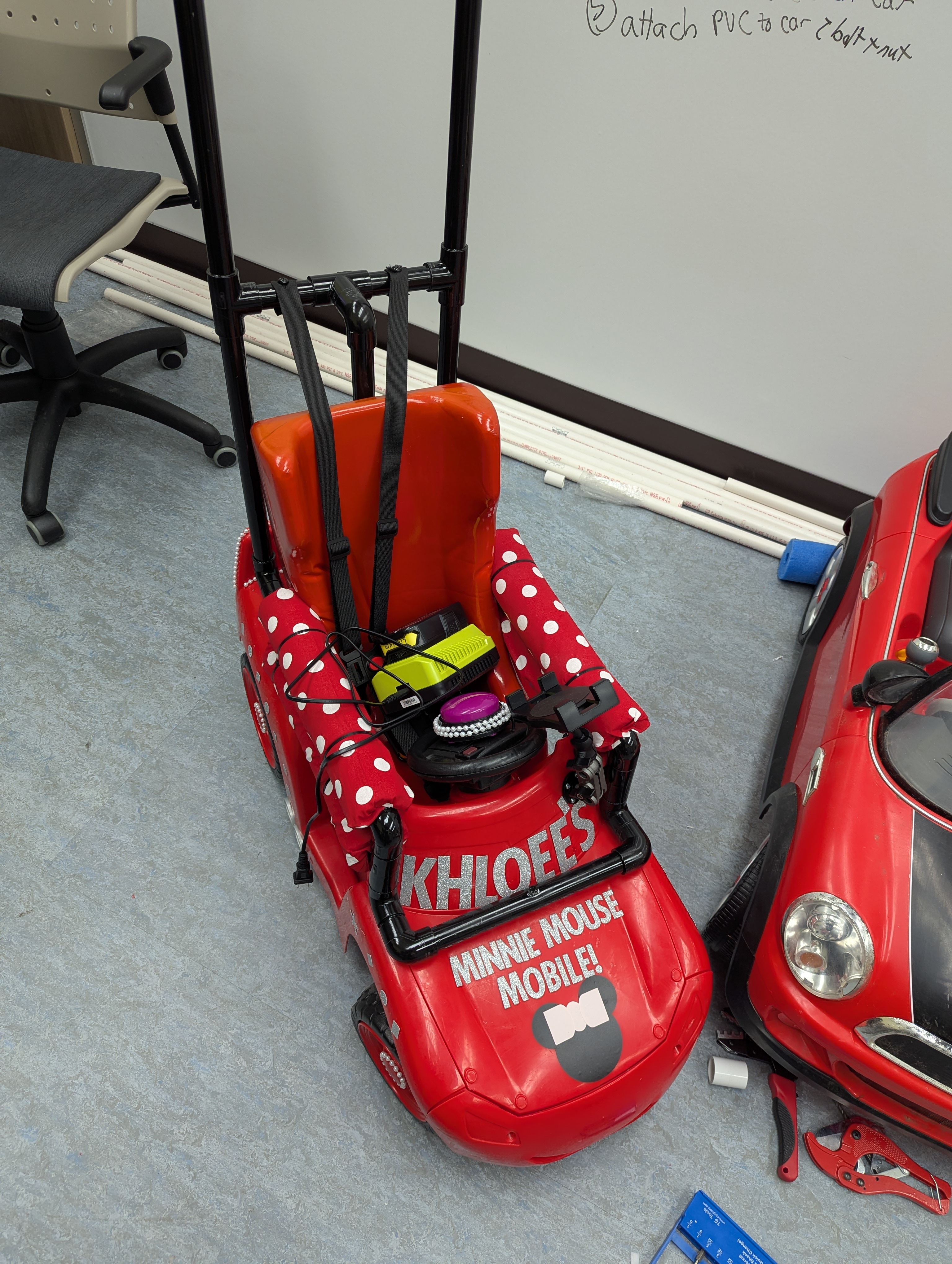 Adapted red ride-on car